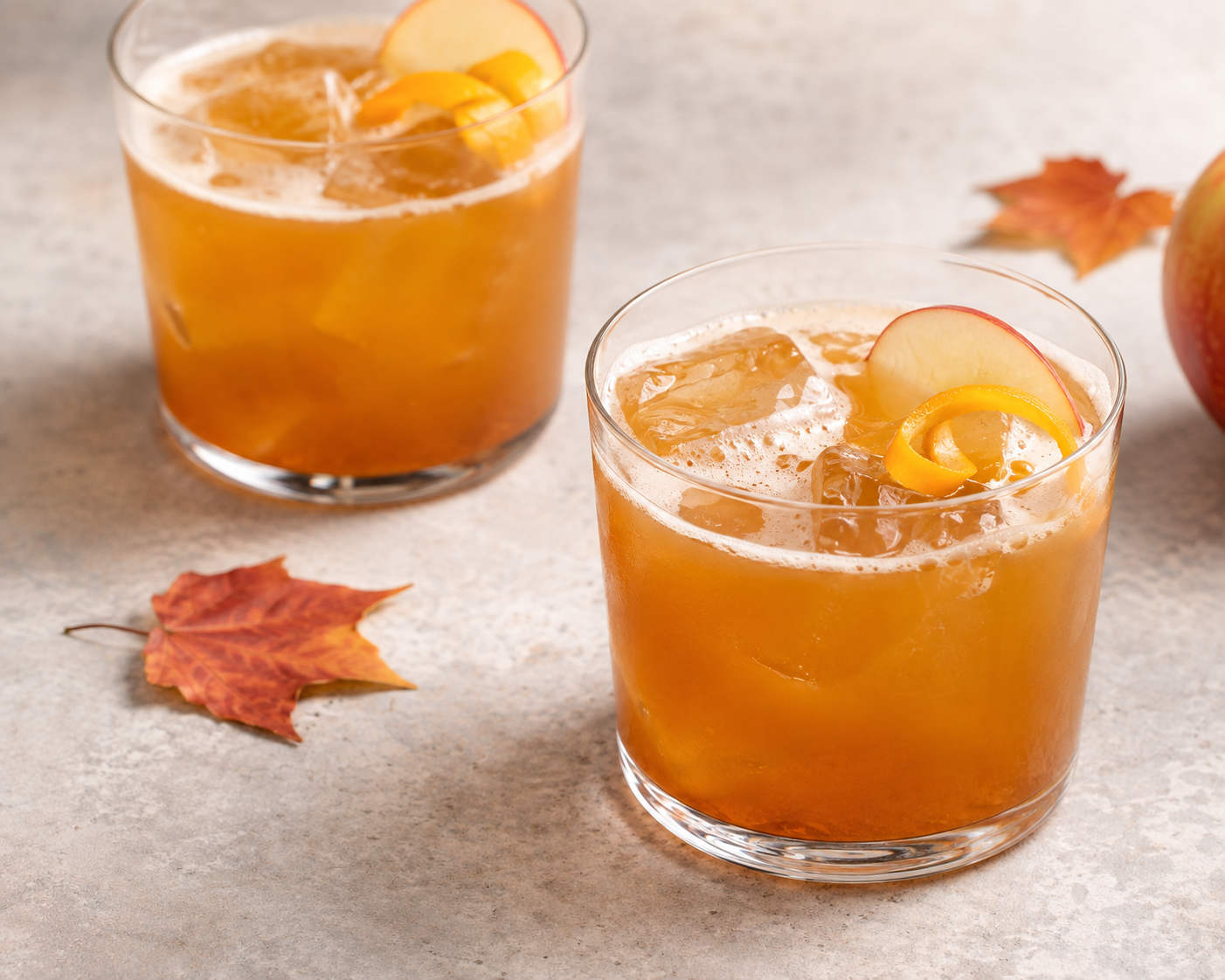 Bourbon Orange and Apple Sour with citrus and aromatic bitters